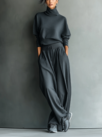 Women's charcoal knit turtleneck and wide-leg trousers set
